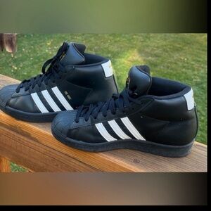 Adidas pro-model high top sneakers.